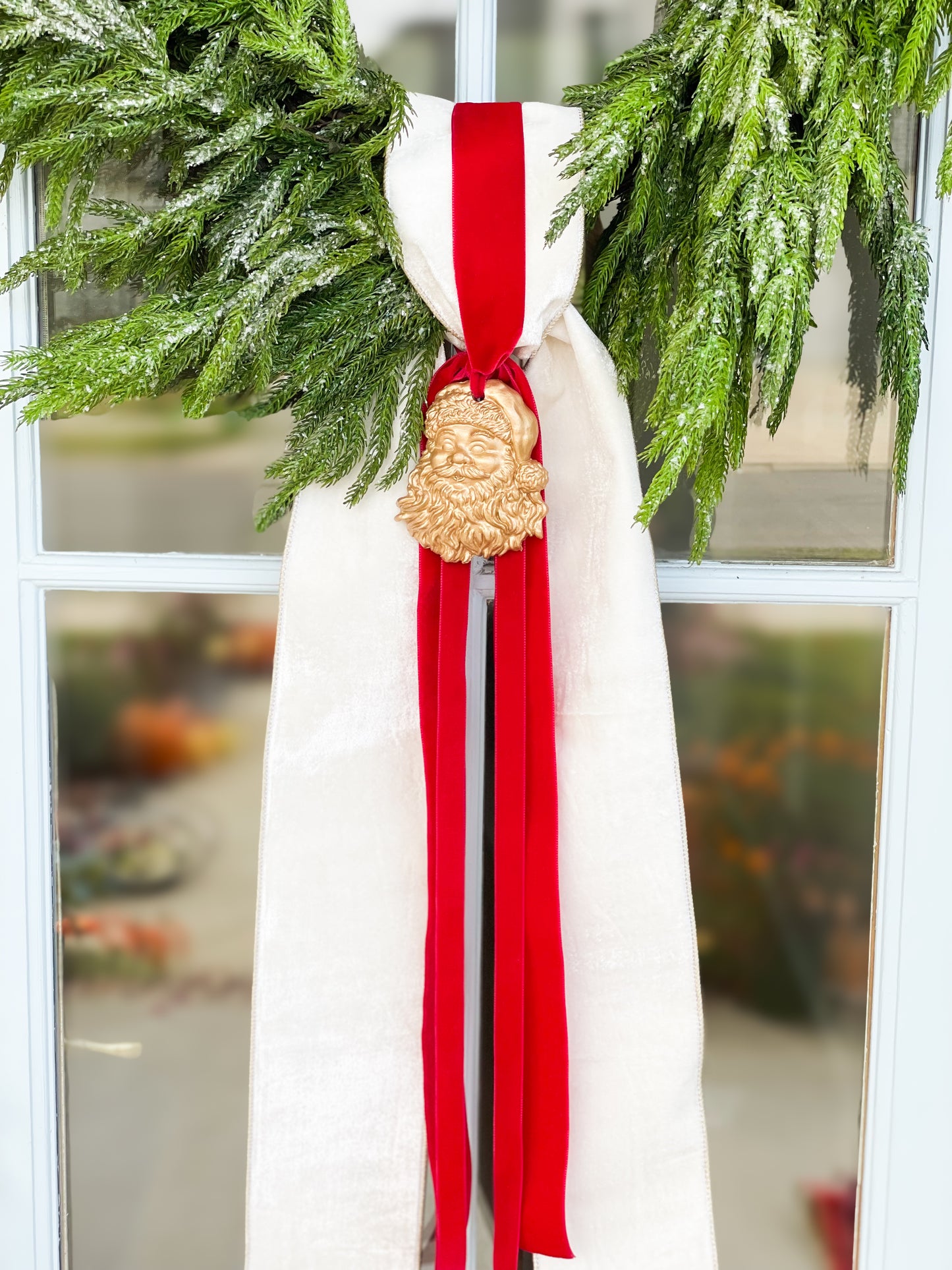 The White Believe Iced Fir Pine Wreath With Sash And Santa