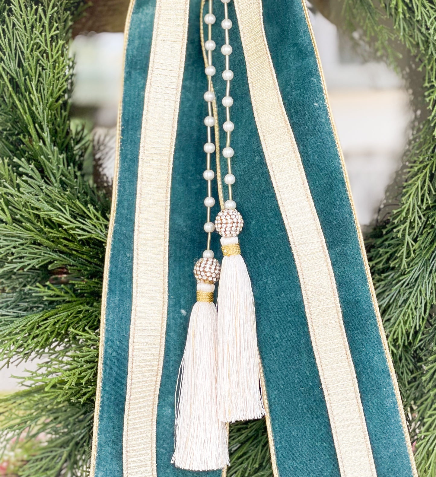 The Celadon Noel Cedar Wreath And Bow With Pearl Tassel.