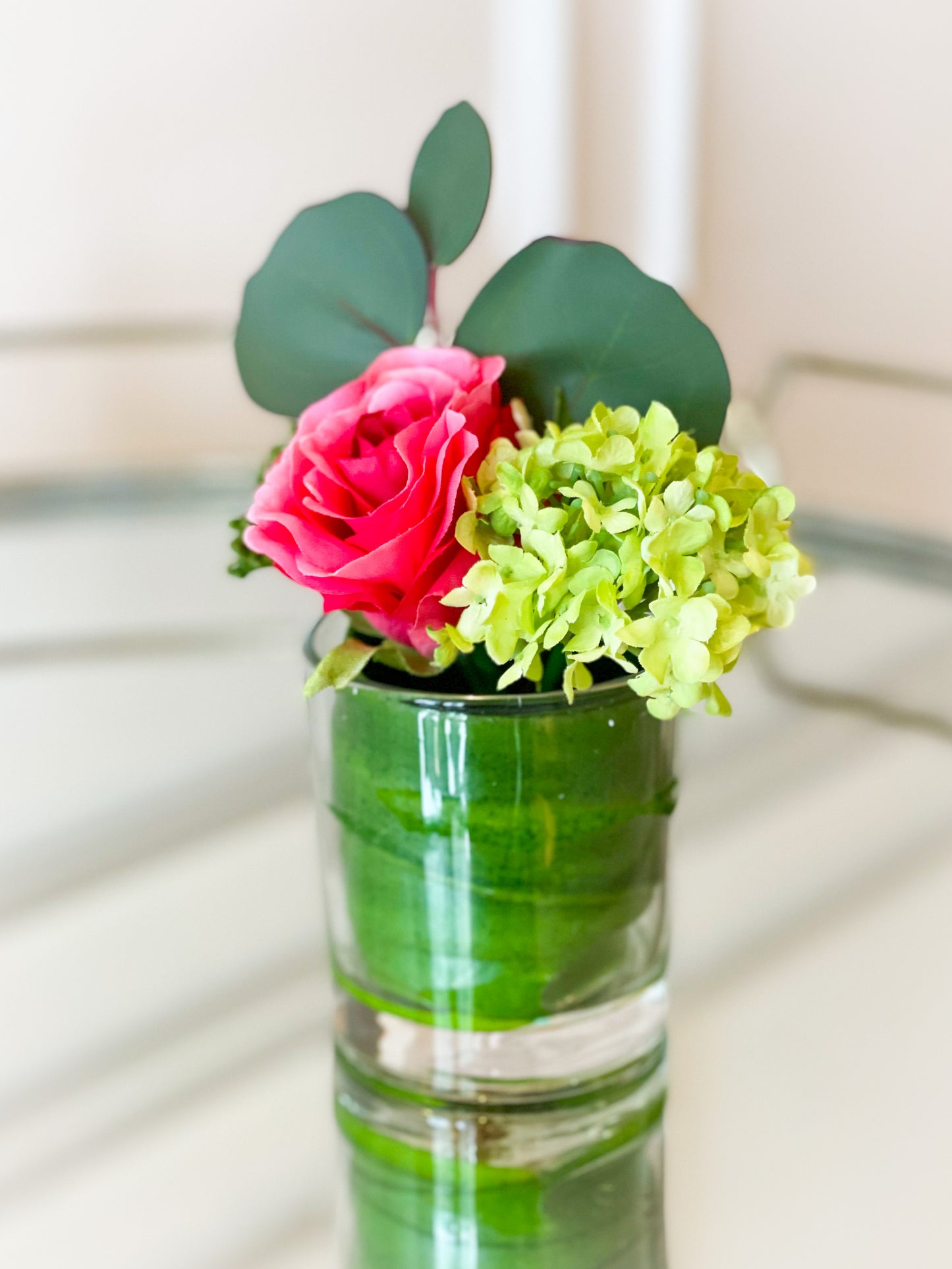 Ranunculus, Rose, And Snowball In A Glass Vase