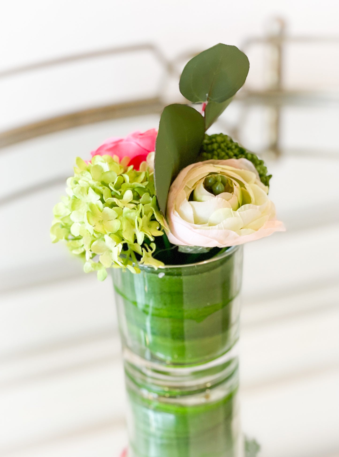 Ranunculus, Rose, And Snowball In A Glass Vase