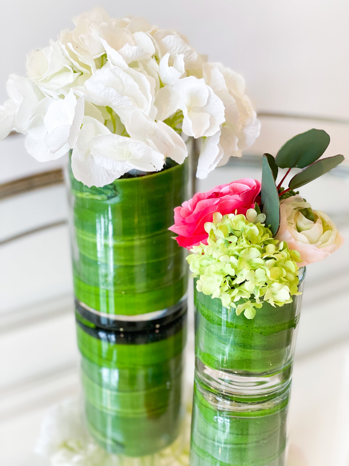 Ranunculus, Rose, And Snowball In A Glass Vase