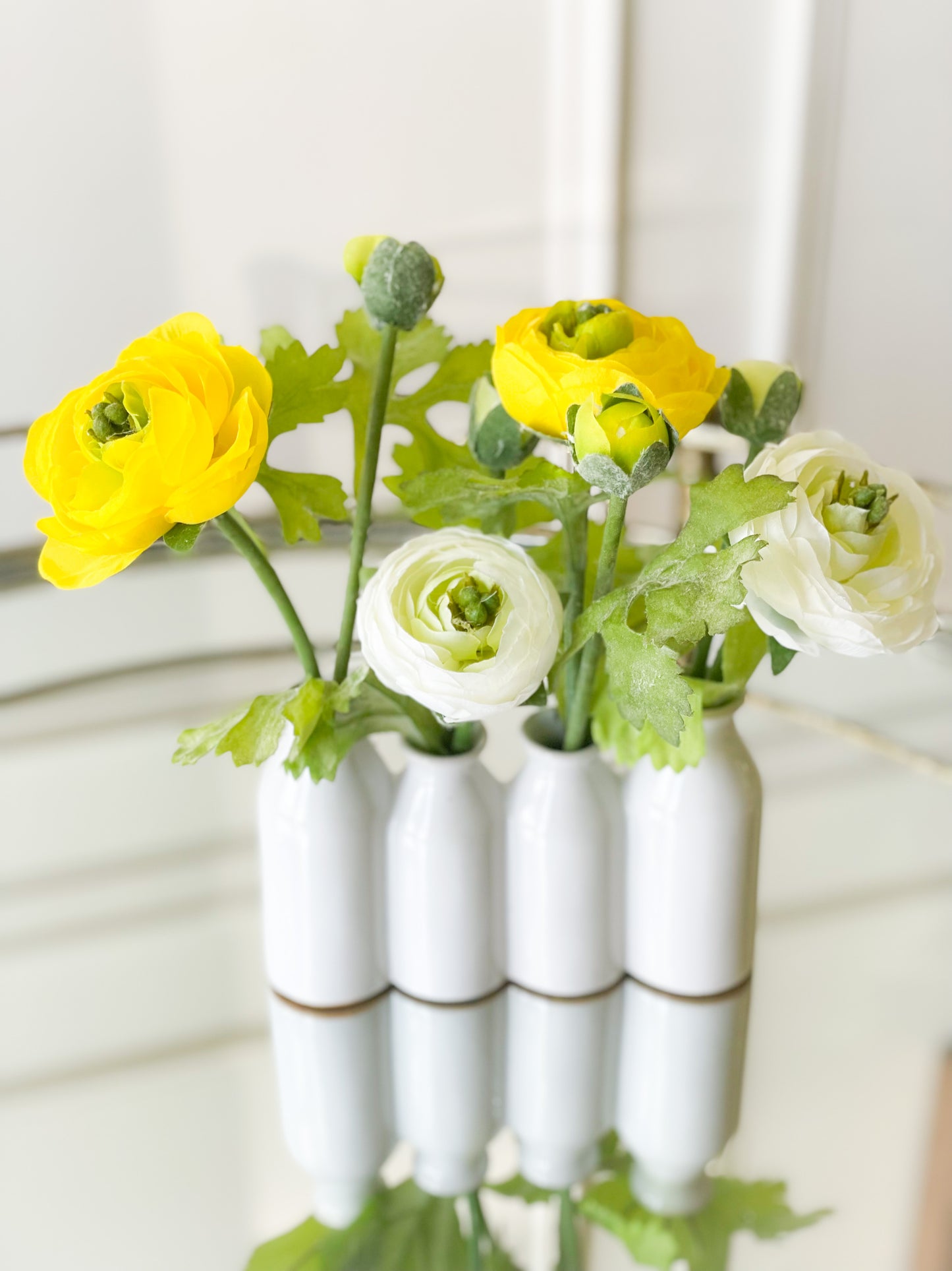 Yellow And White Ranunculus In Ceramic Vase