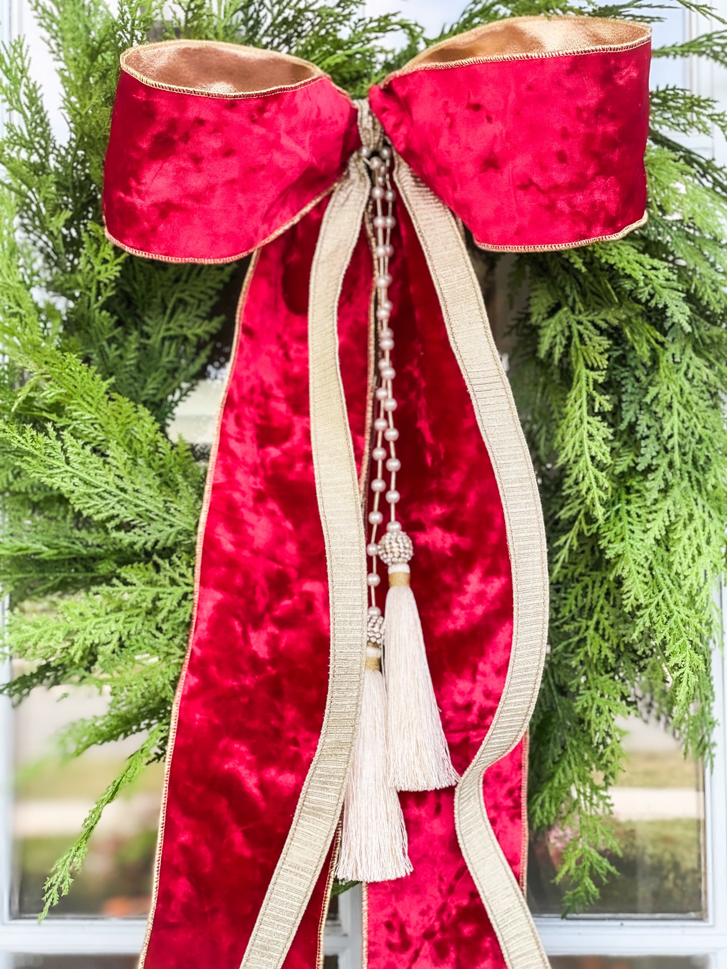 The Red Noel Cypress Wreath And Bow With Pearl Tassel