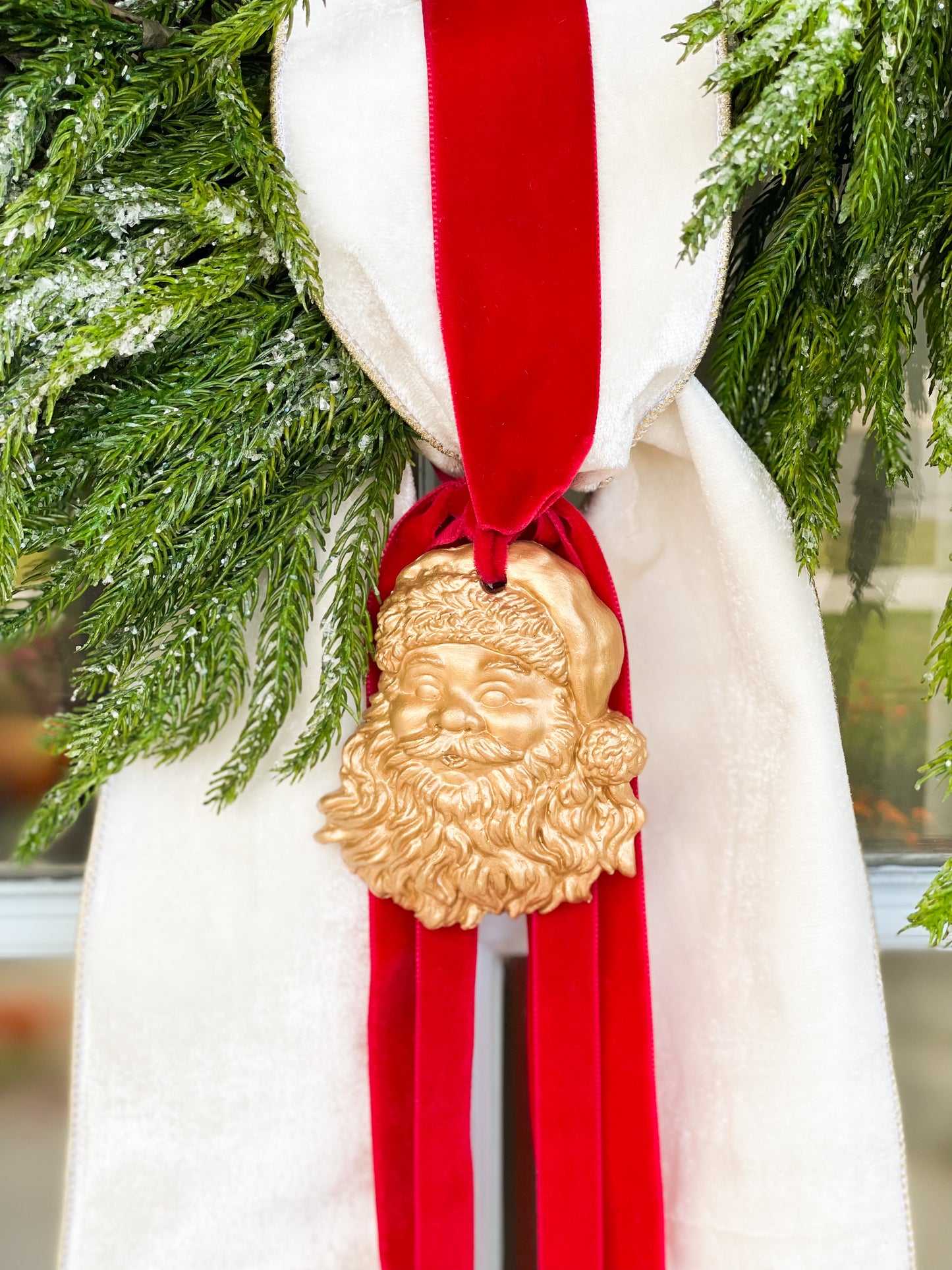 The White Believe Iced Fir Pine Wreath With Sash And Santa