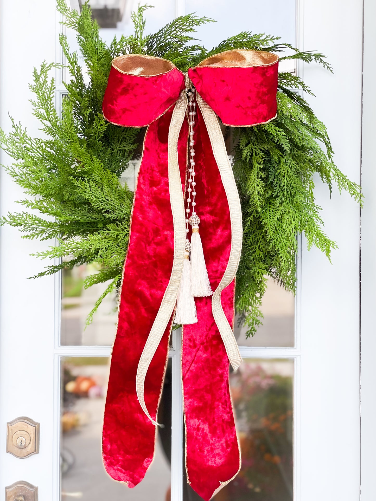 The Red Noel Cypress Wreath And Bow With Pearl Tassel