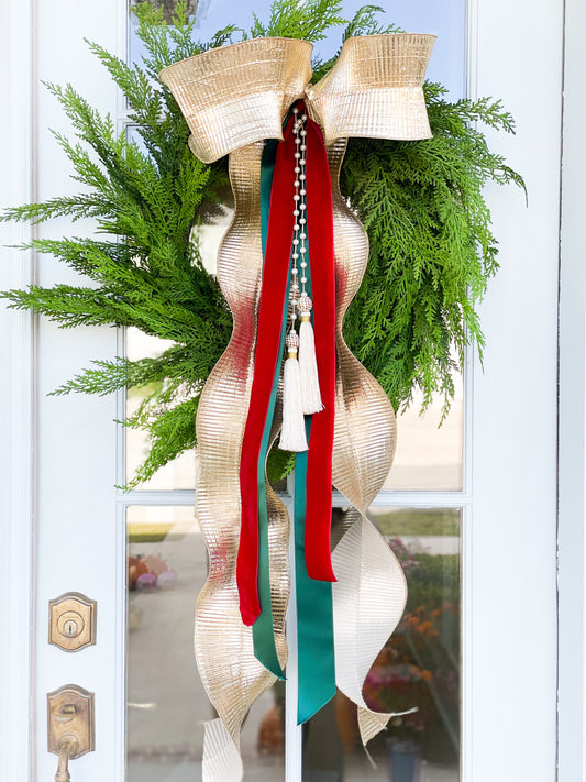 The Gold Noel Cypress Wreath And Bow With Pearl Tassel