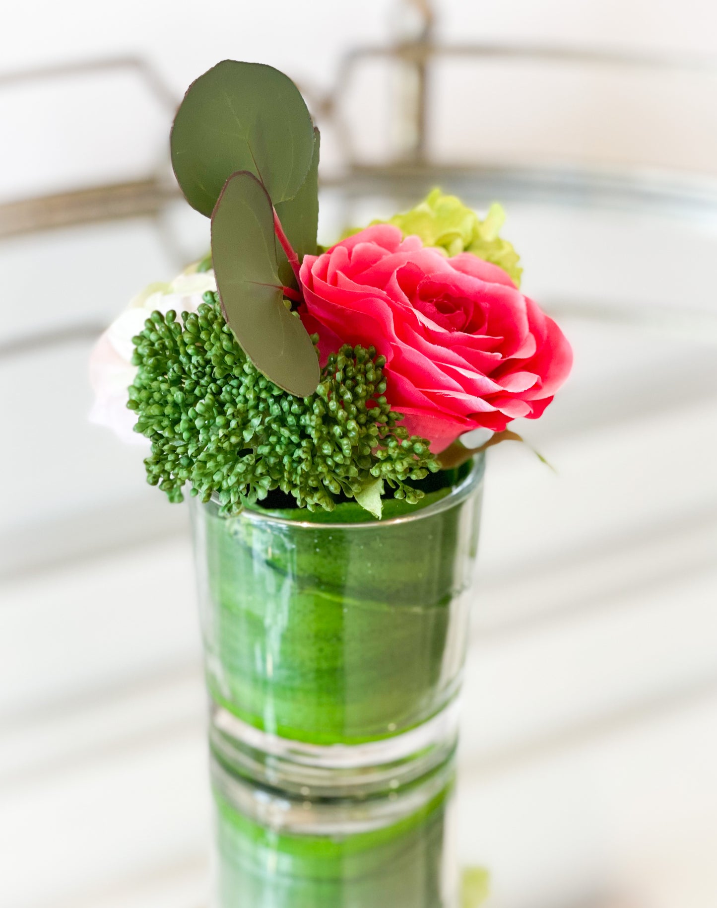 Ranunculus, Rose, And Snowball In A Glass Vase