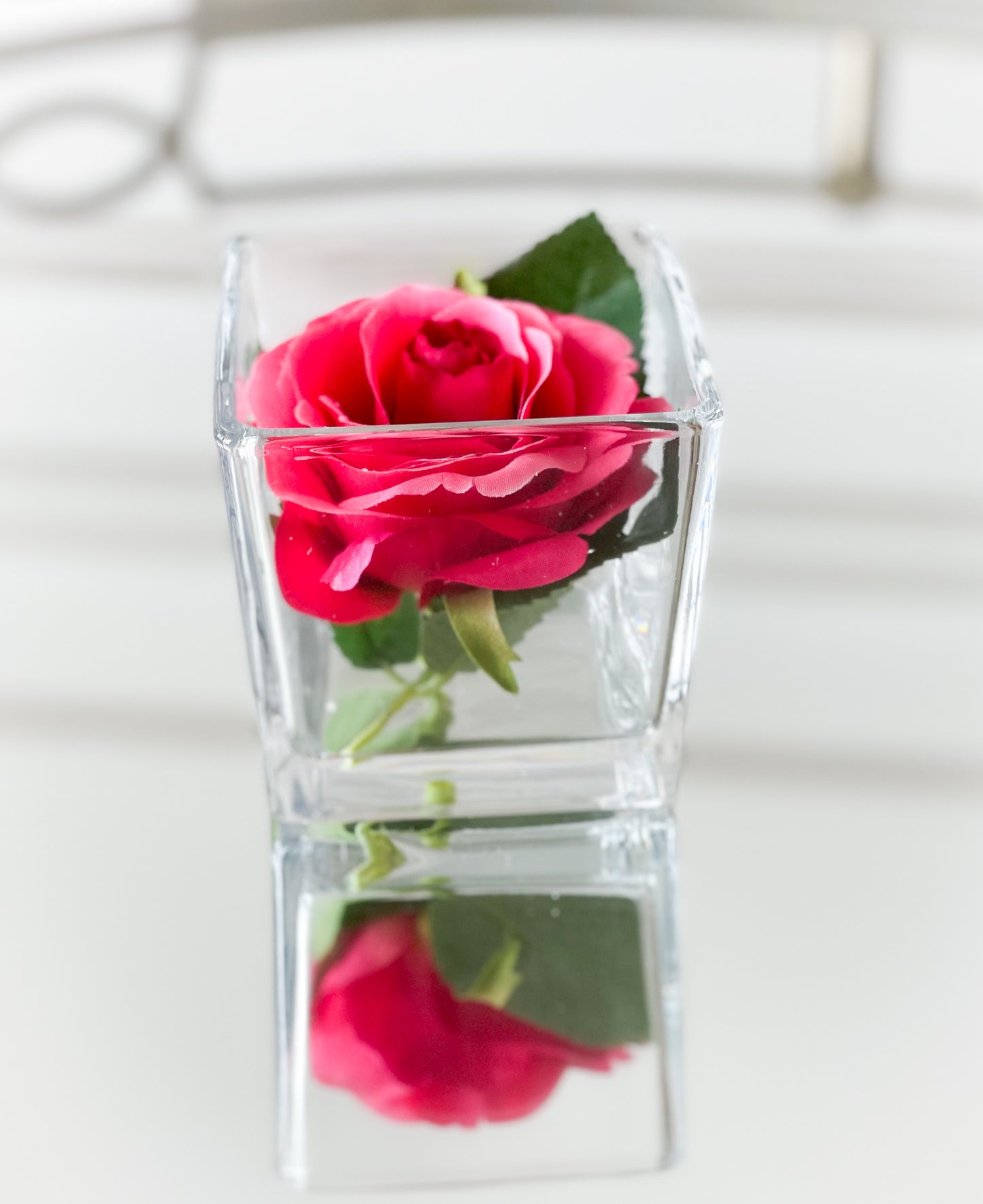Pink Rose Bloom In Glass Vase